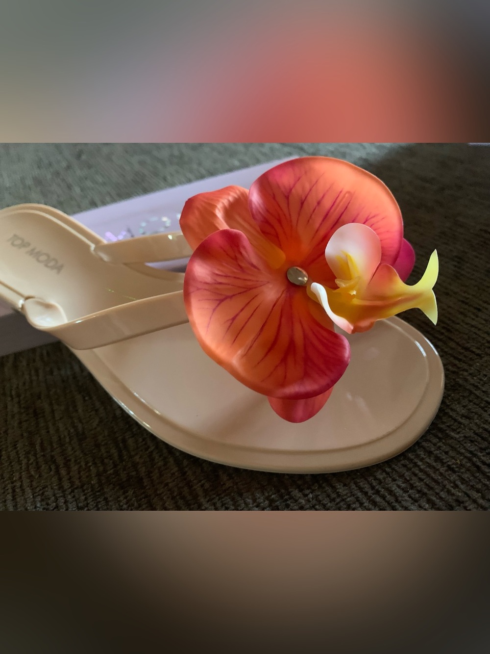 Top Moda floral thong flat sandal featuring a vibrant orange and red orchid